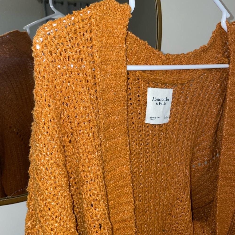 Never worn Abercrombie cardigan sweater. Size large.
